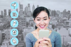 A smiling person holds a phone in front of the Philadelphia skyline, surrounded by print-related icons that suggest multiple ways to connect online.