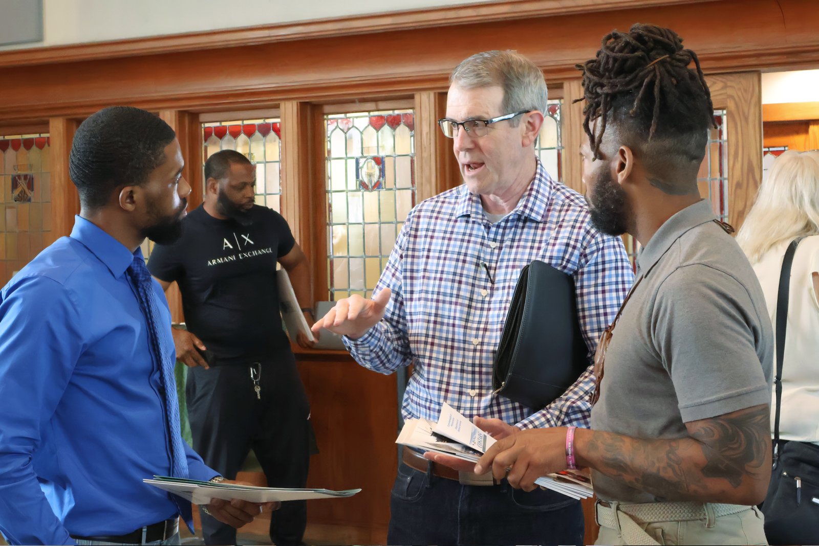 Steve Fillmore of East Falls Media speaks with attendees during a small business outreach event, highlighting the value of in-person conversations. (June 2025)