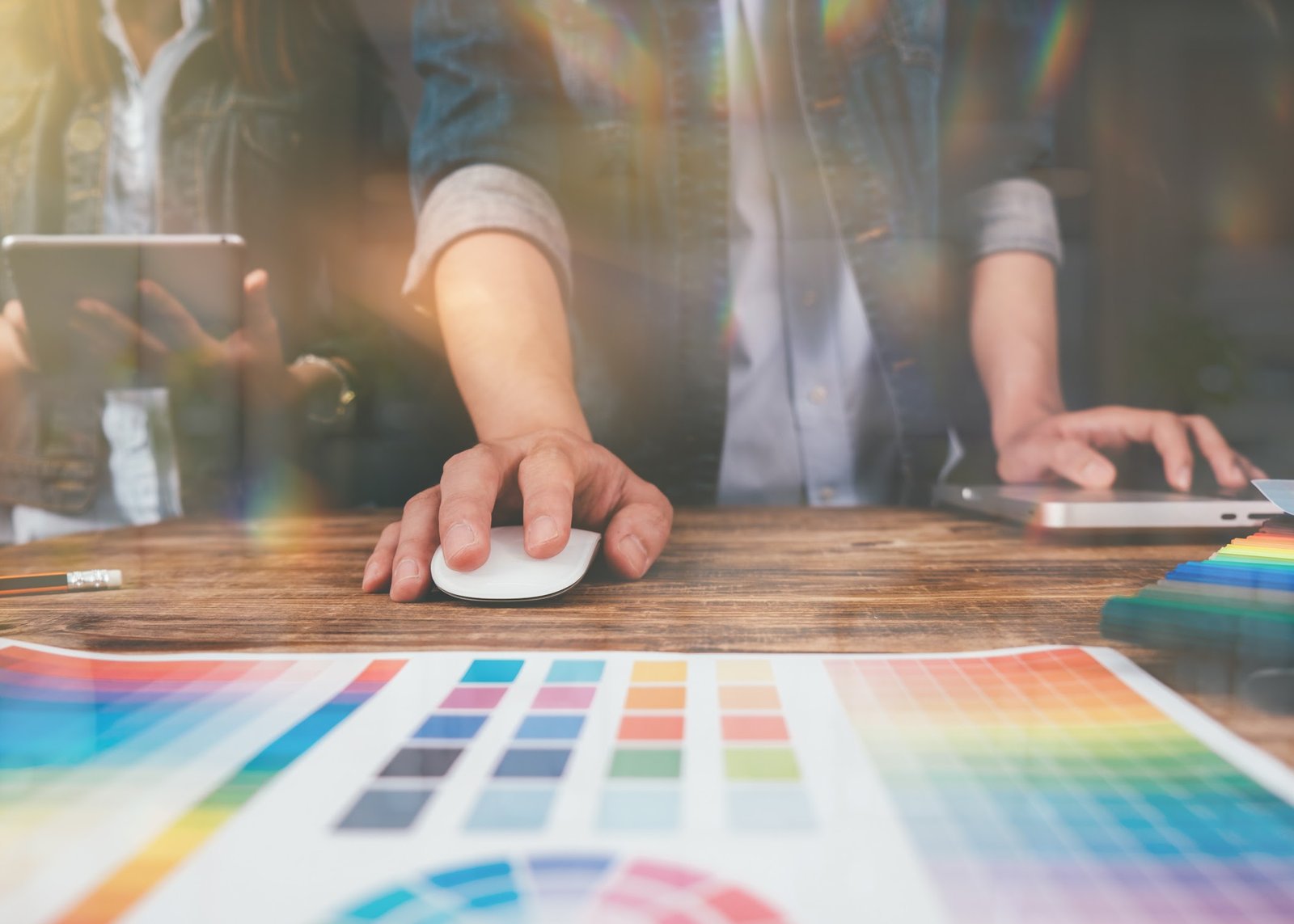 Local creative freelancer working with color swatches and design tools to improve a turnkey chamber publication.